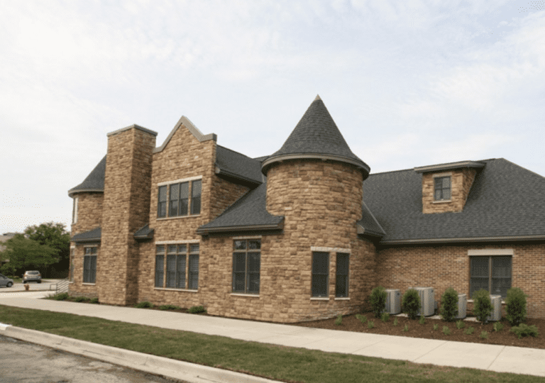 A rendering of a brick home with turrets.