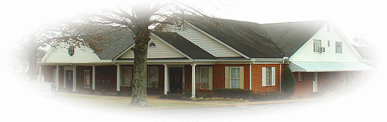 A white house with a red roof.