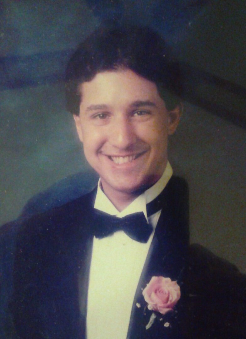 A young man in a tuxedo.