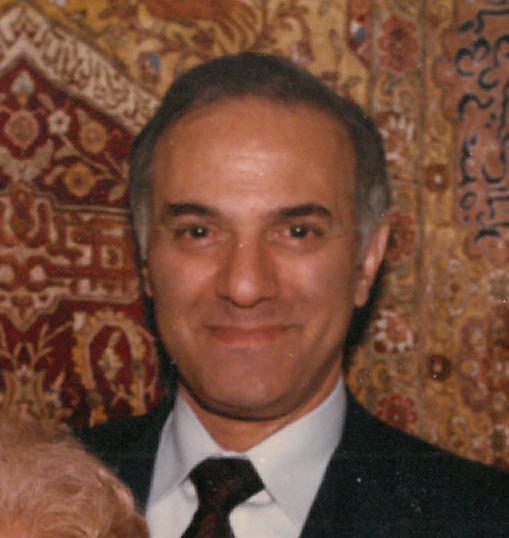 A man in a suit and a woman in a tie.
