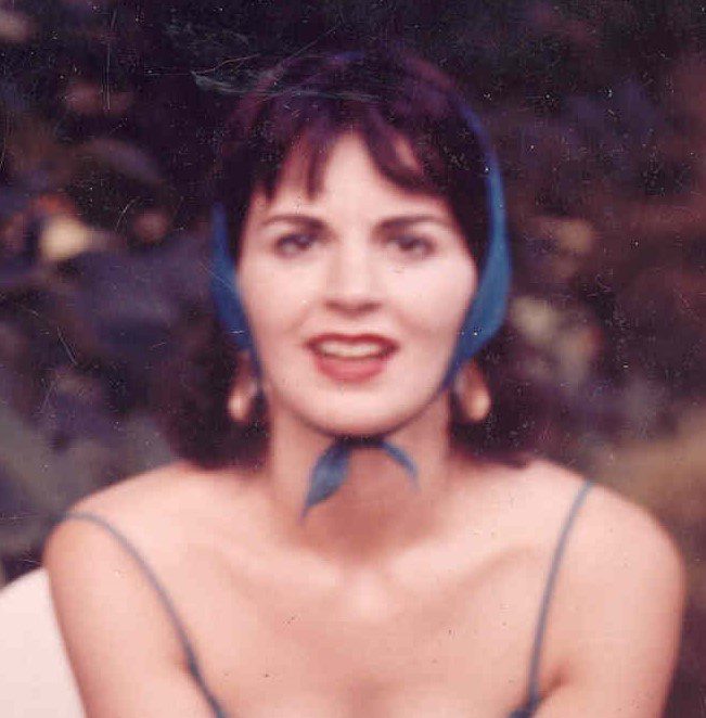 A woman wearing a blue dress.