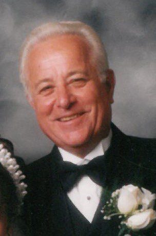 A man in a tuxedo and a woman in a wedding dress.