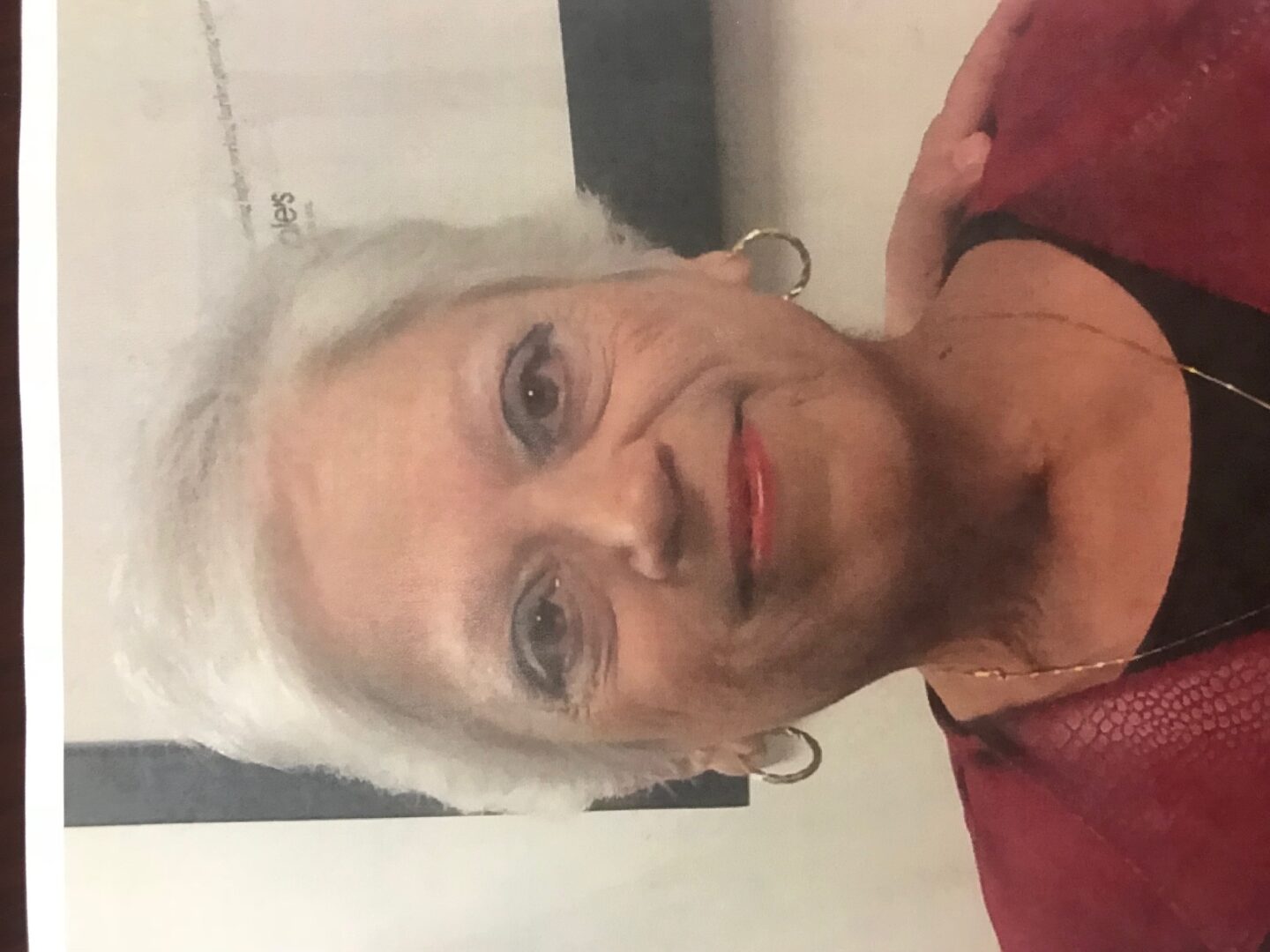 A photo of an older woman with white hair.