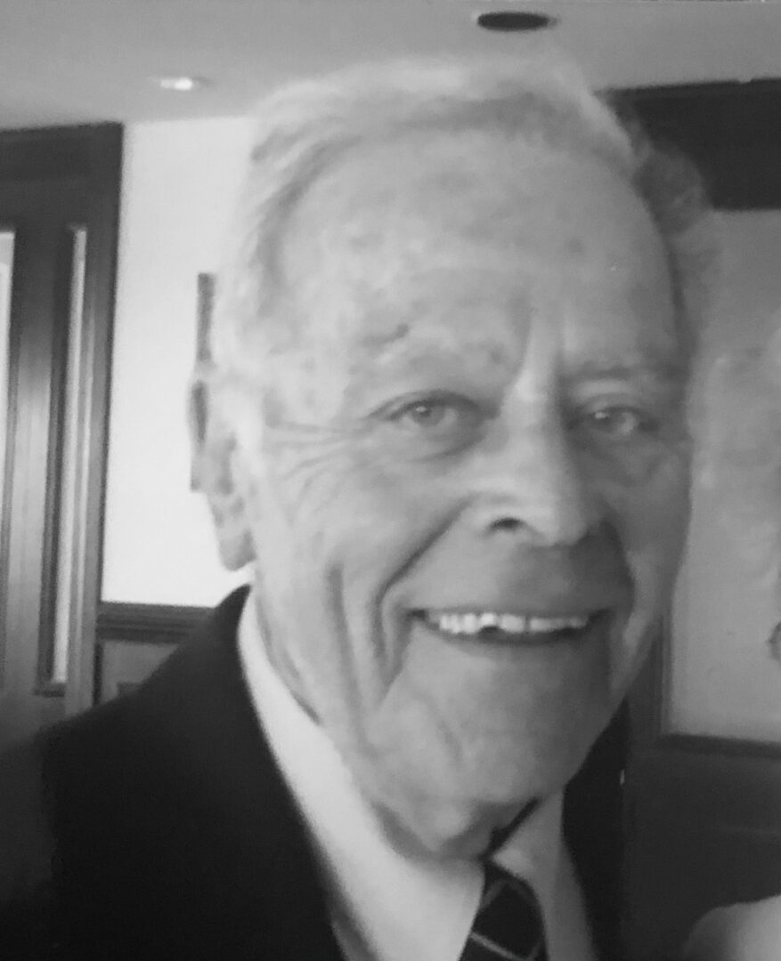 A black and white photo of an older man and woman.