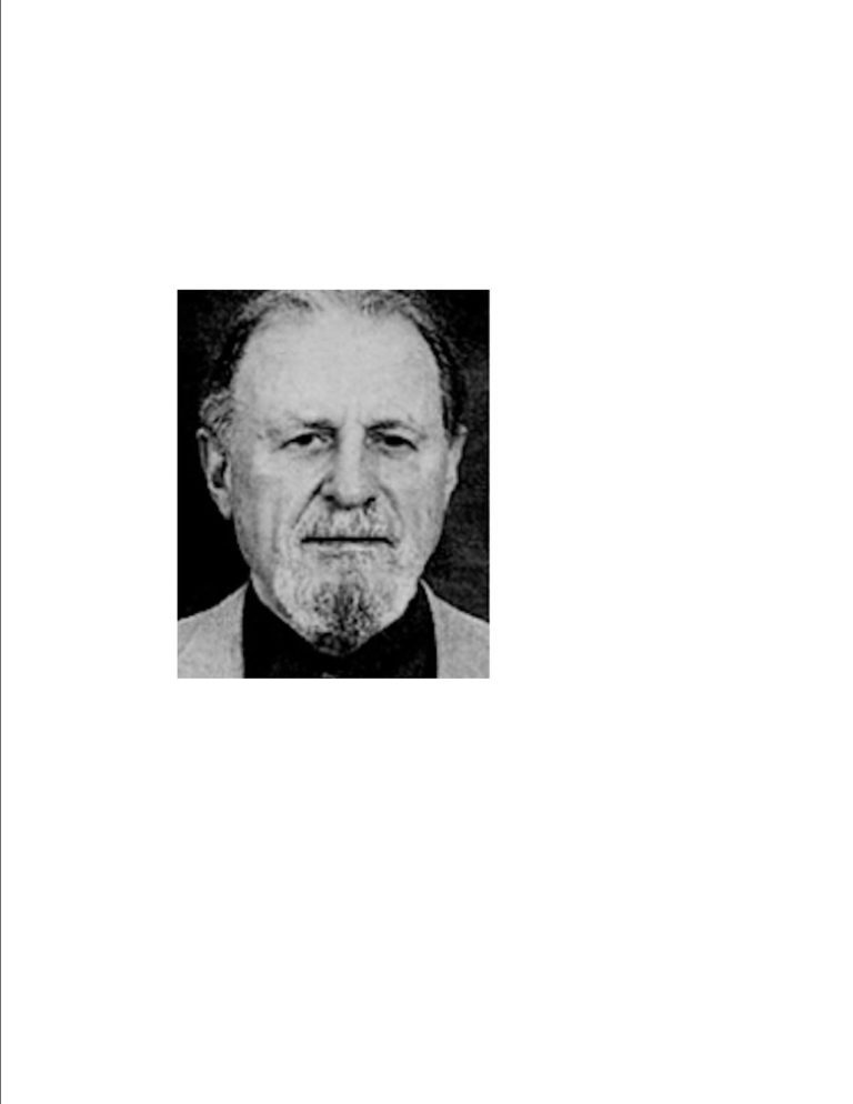 A black and white photo of a man with a beard.