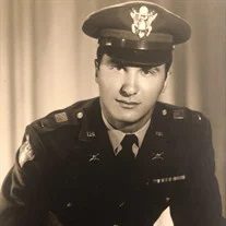 A black and white photo of a man in a military uniform.