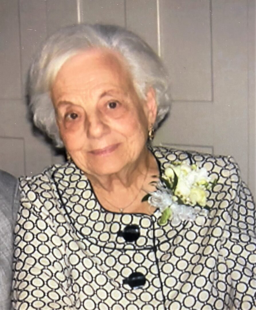 An older woman is sitting next to an older man.