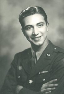 A black and white photo of a man in uniform.