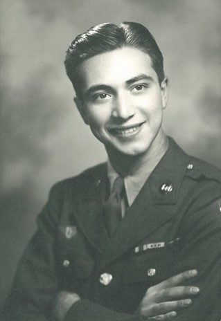 A black and white photo of a man in uniform.