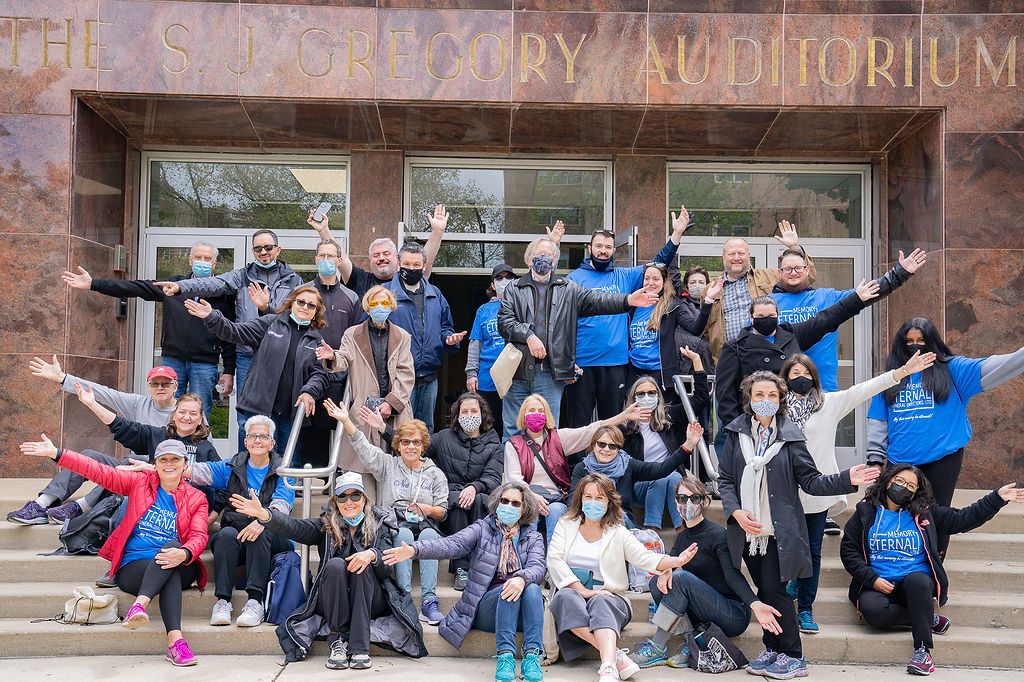 Group image of so many girls with hands up