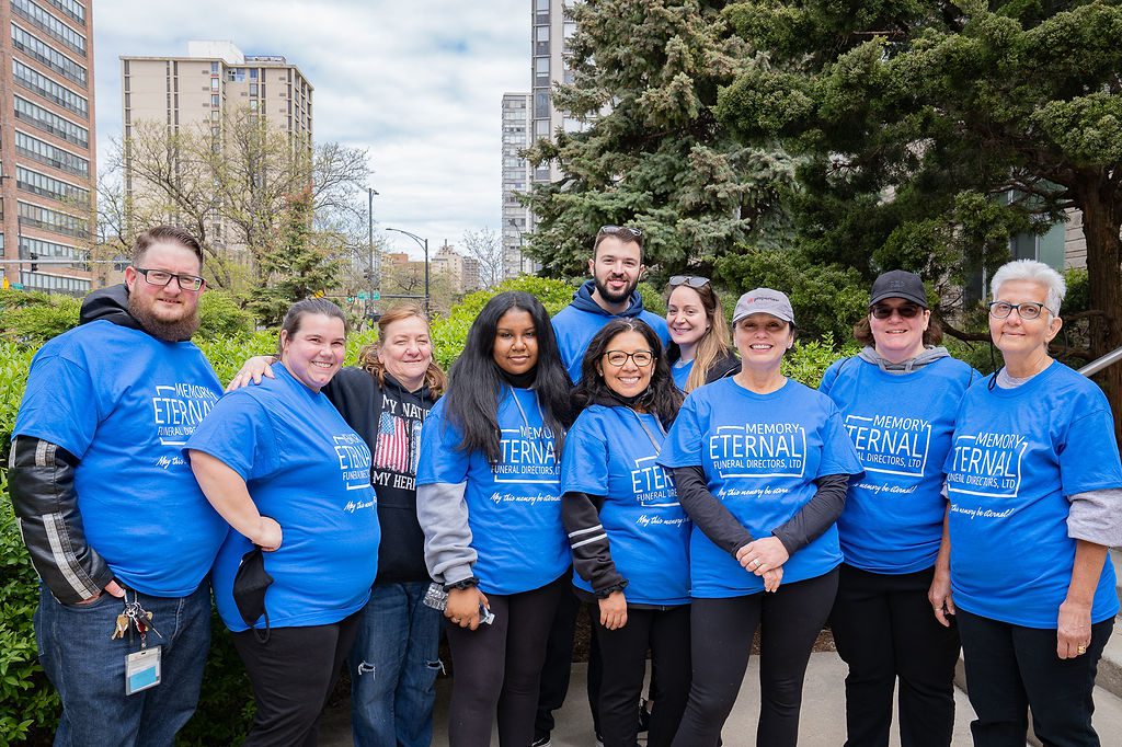 A group of people in blue t - shirts posing for a photo.