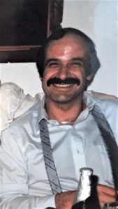 A man with a moustache and a woman with a mustache.