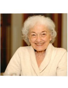 An older woman smiling for the camera.