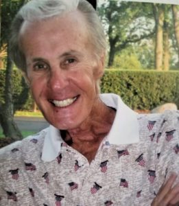 A picture of an older man with a smile on his face.