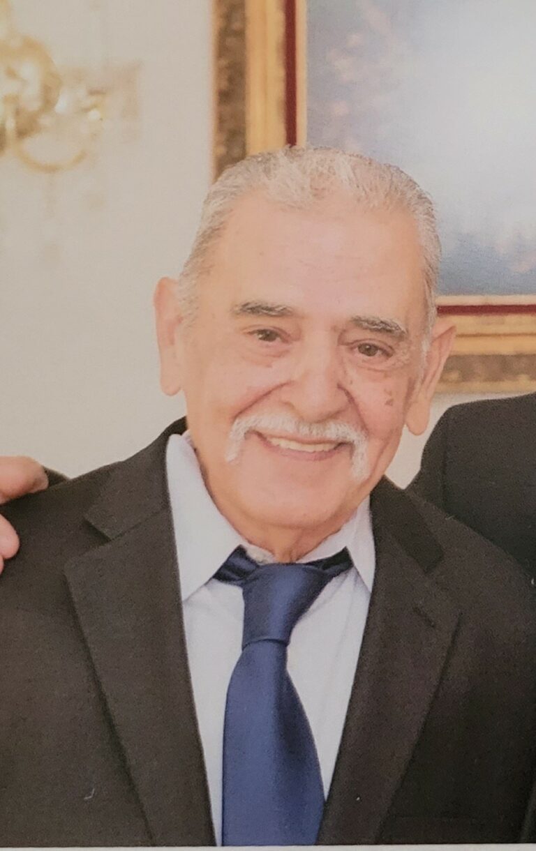 Two older men posing for a photo.