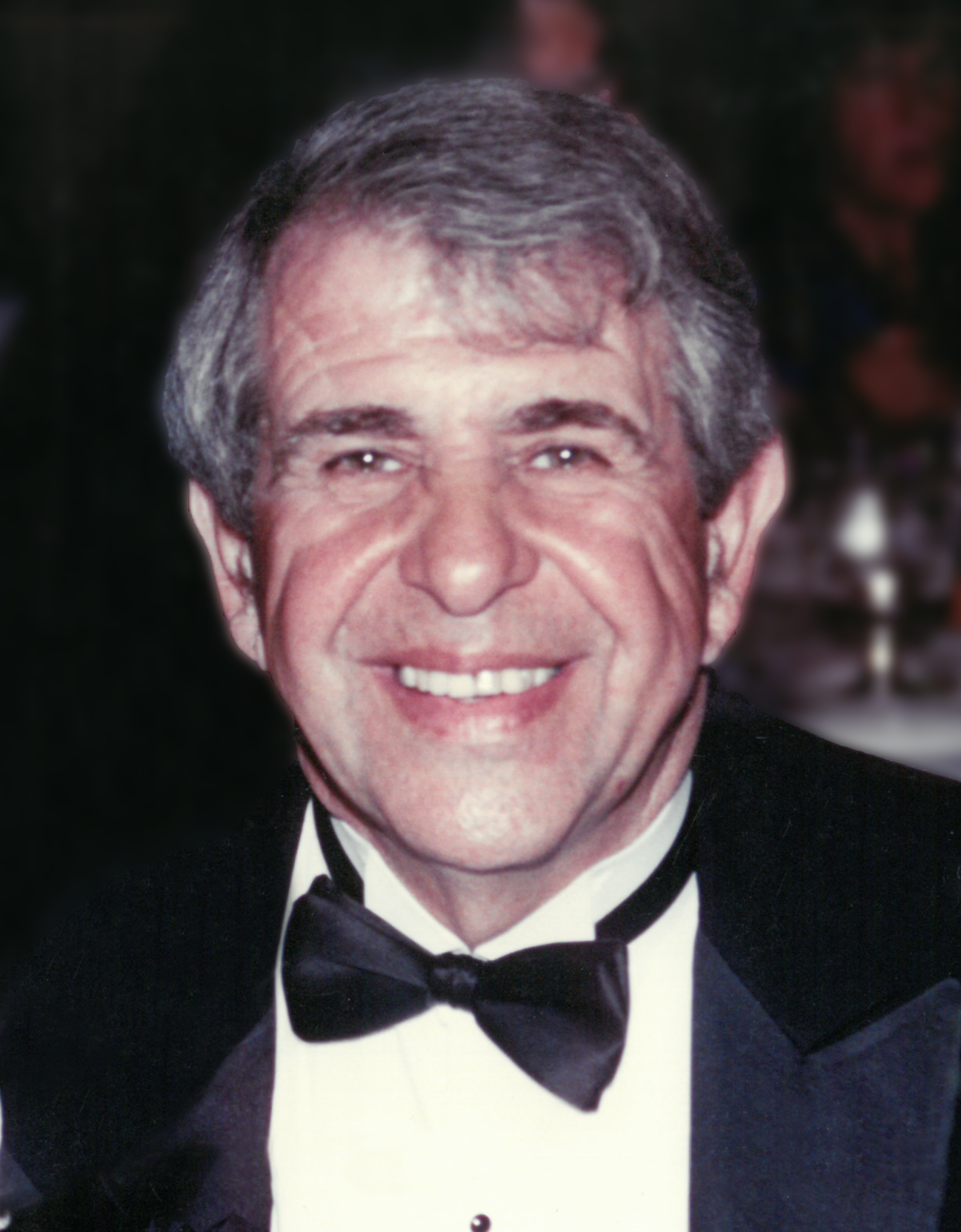 A man in a tuxedo.