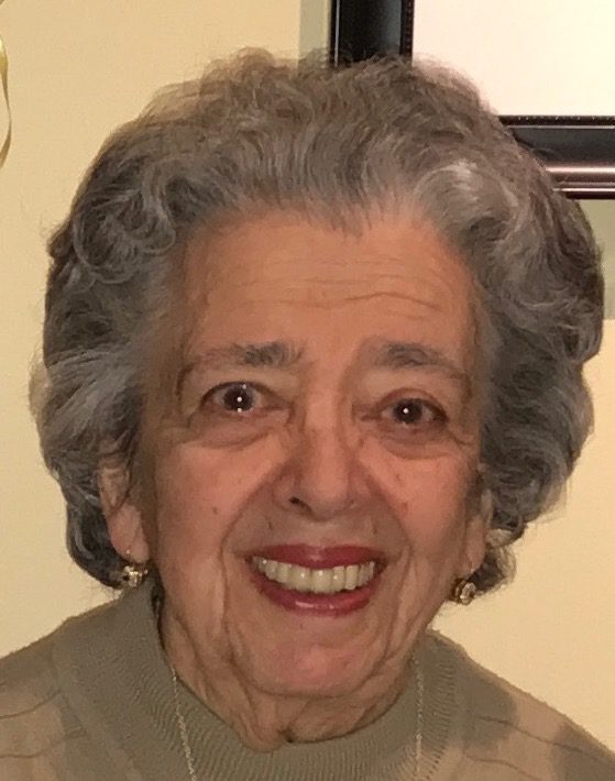 An older woman smiling for the camera.
