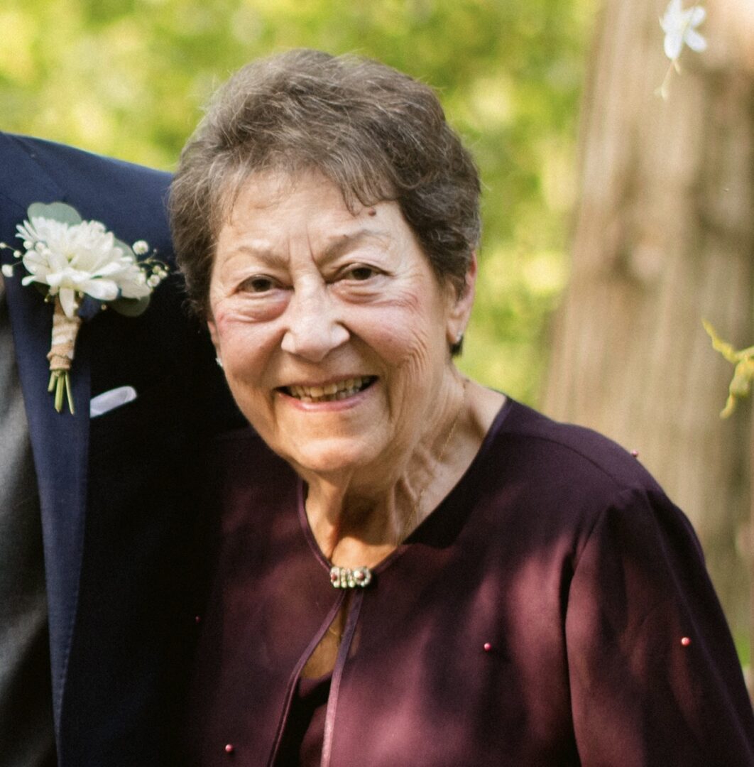 A man and an older woman smiling for the camera.