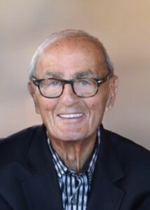 Lilly Kretsos, an older man in glasses, smiling for the camera.