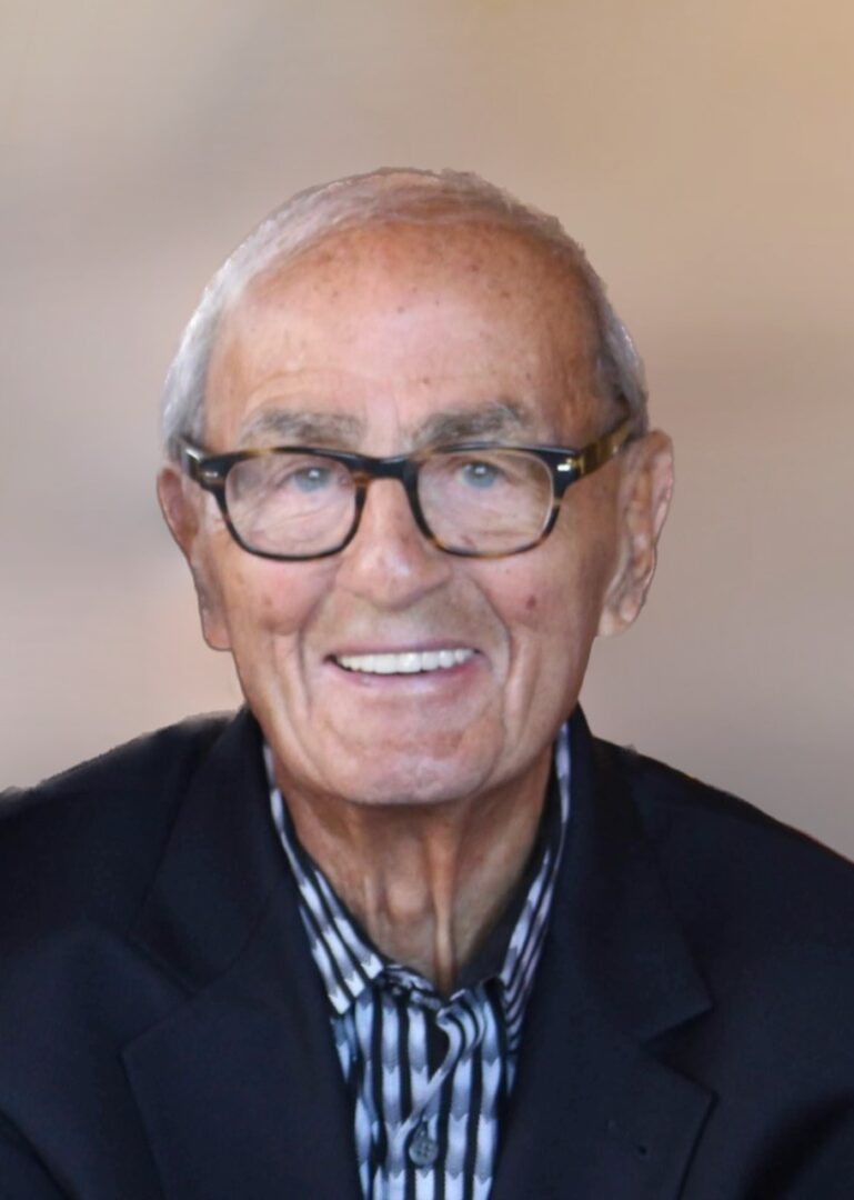 Lilly Kretsos, an older man in glasses, smiling for the camera.