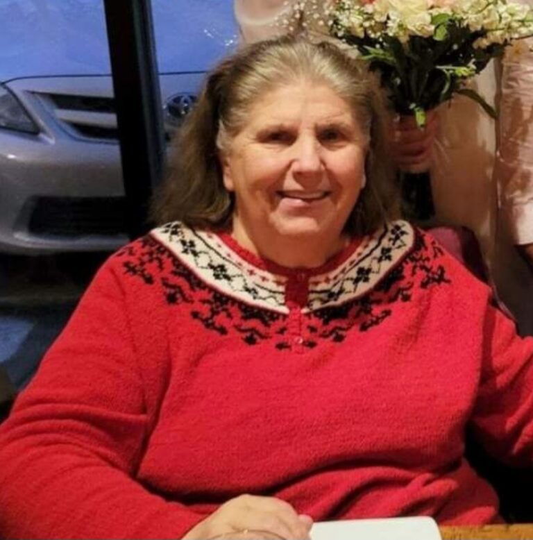 Close up image of an old lady smiling at the camera