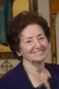 Close up shot of an old lady smiling at the camera