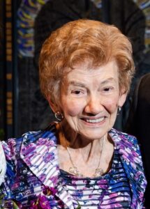 Close up image of an old woman smiling at the camera