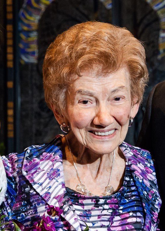 Close up image of an old woman smiling at the camera