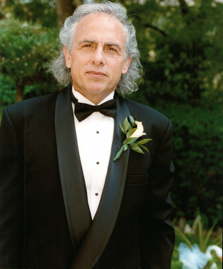 A man in a tuxedo wearing a bow tie.