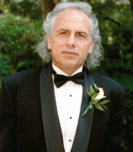A man in a tuxedo wearing a bow tie.