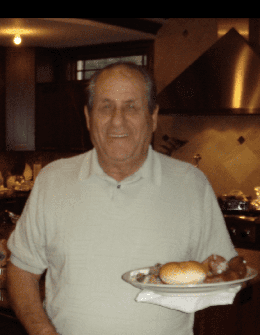 A man holding a plate of food.