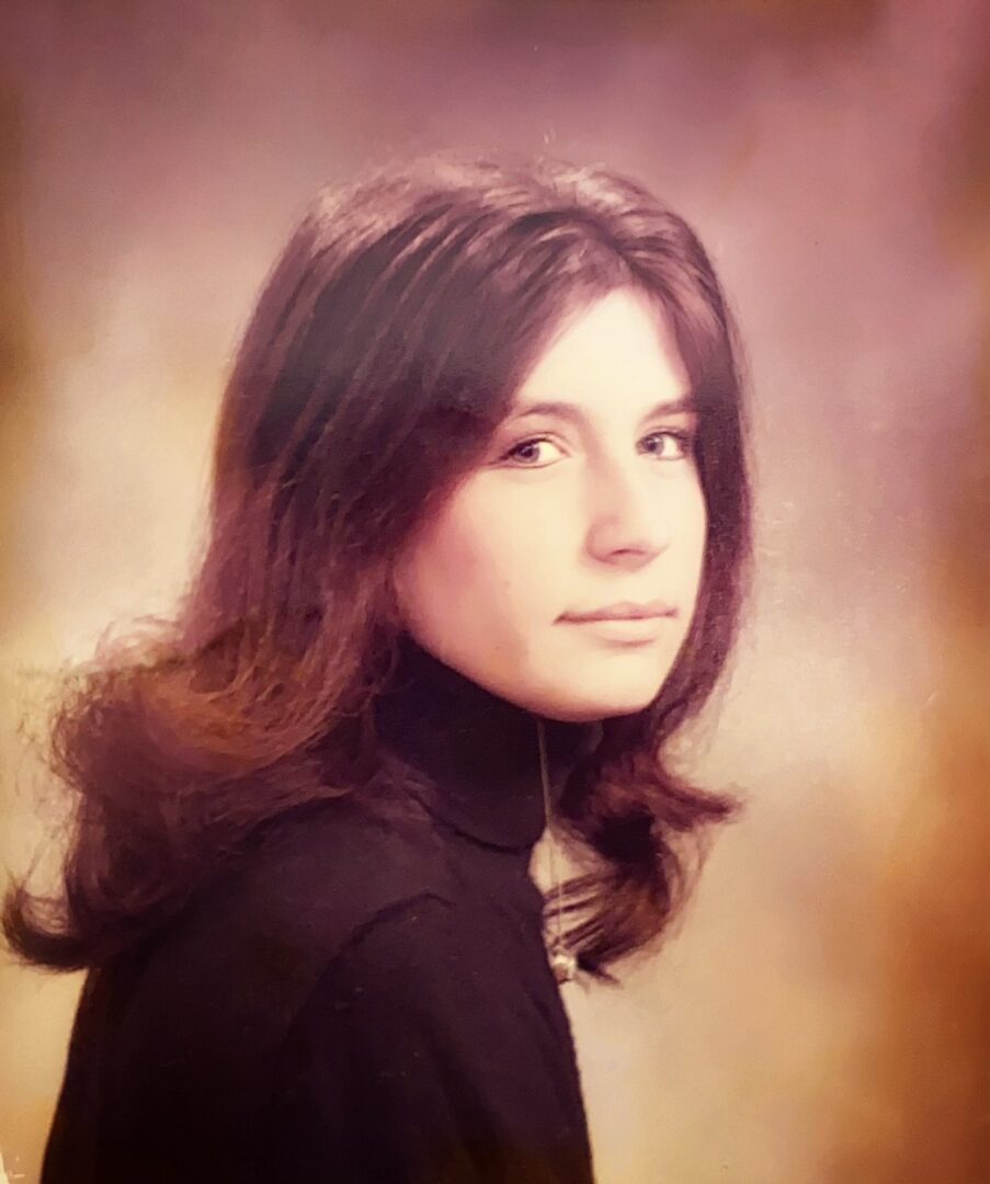 Side profile of a young woman with long hair.